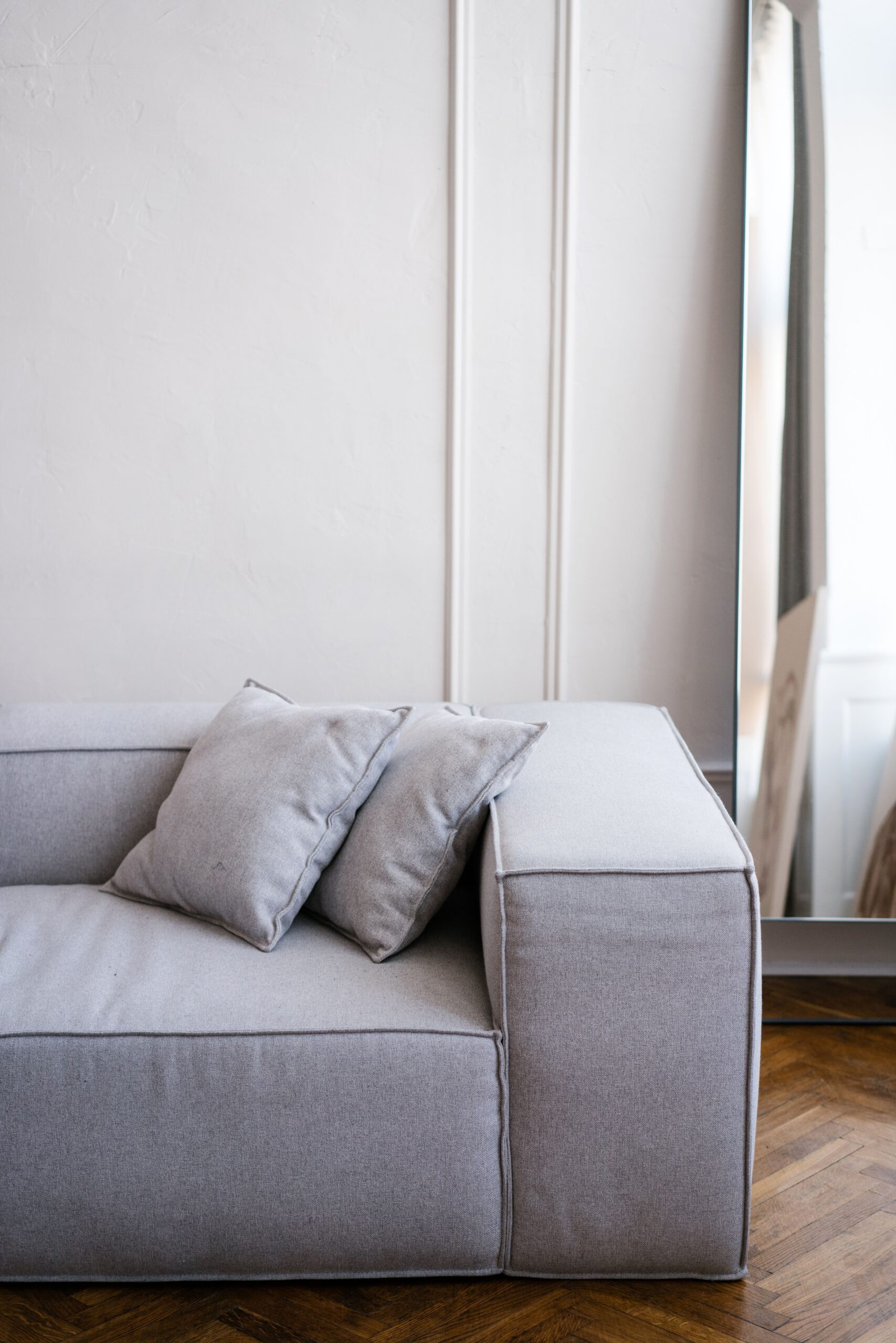 Couch grey, white wall background